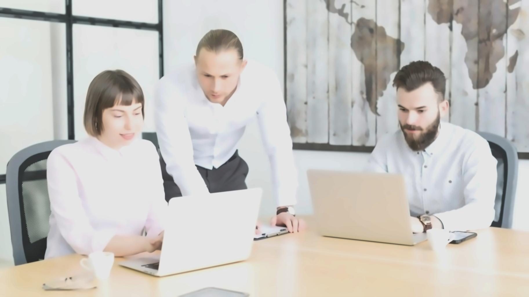 Investment community members reviewing market analysis together